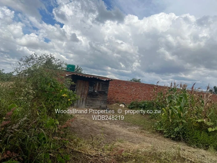Conveniently located vacant stand,  walled on one side,  electricity available,  measuring 1803sqm 